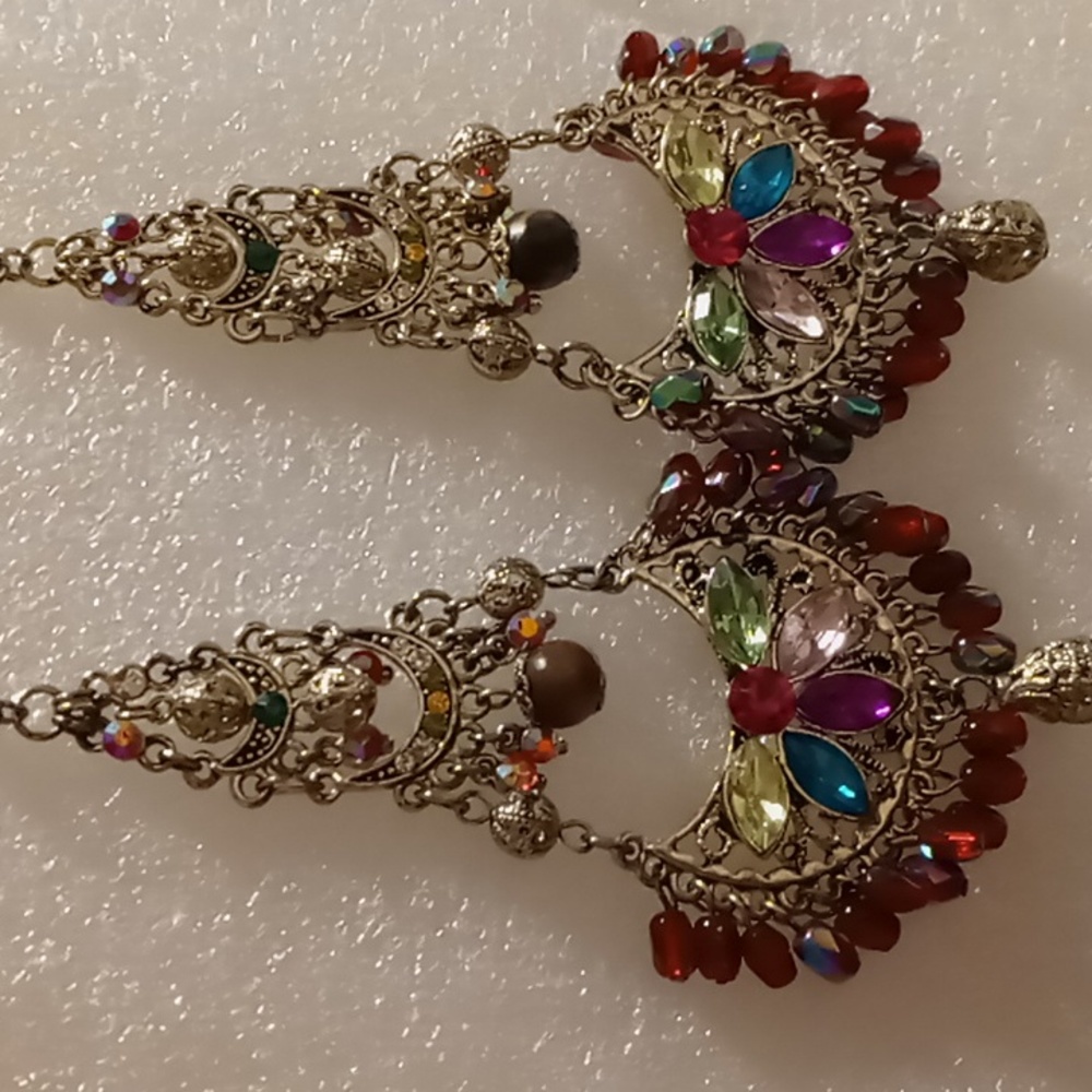Dangling earrings with Opalescent beading reds, greens beautiful blues.
